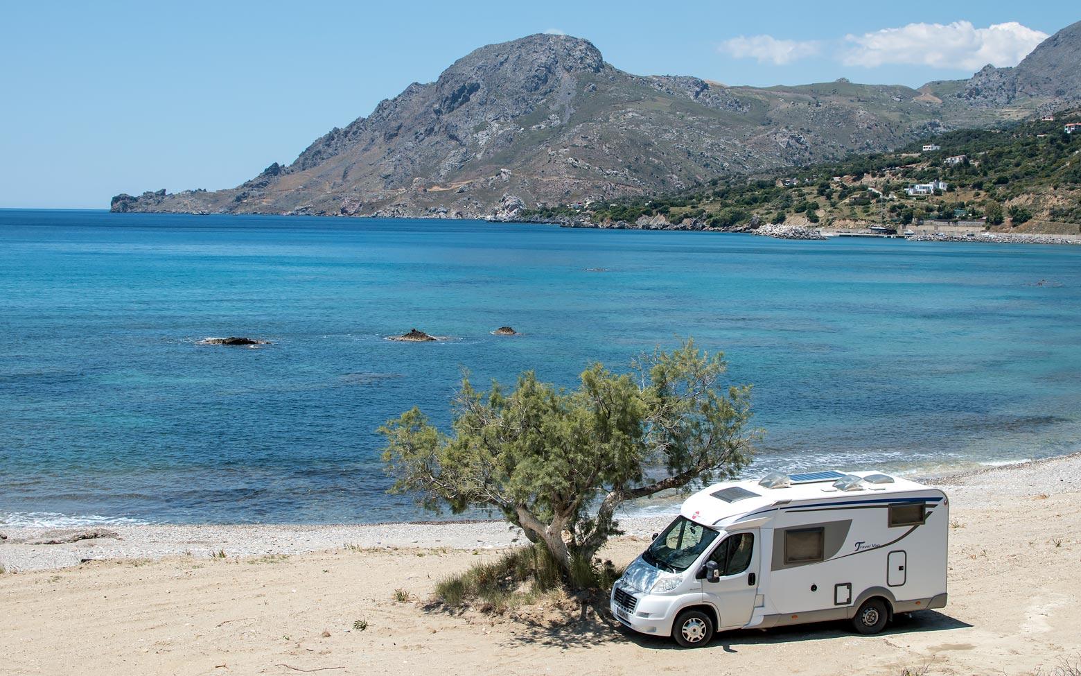 photo of a car on a crete beach