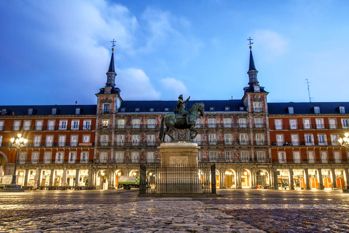 a horseman monument on plaza major in madrid at sunrise