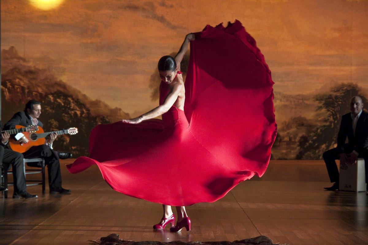 girl in a red dress dancing flamenco