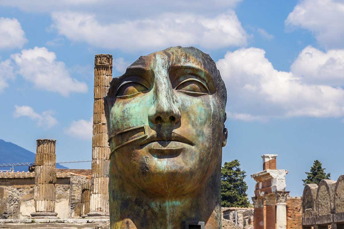 TOP Unesco sites in Italy - Pompeii, picture of ancient head monument