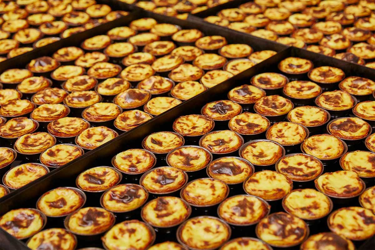 close up to dozens pasteis de nata custards