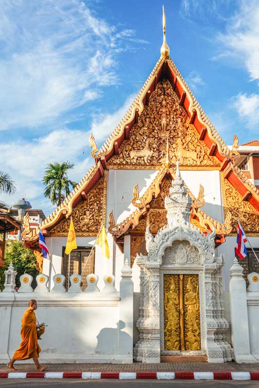 thai temple with a monk