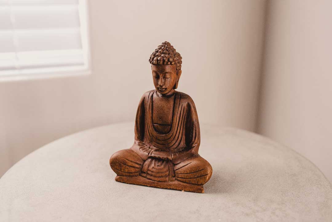 decorative buddha statue in a white room