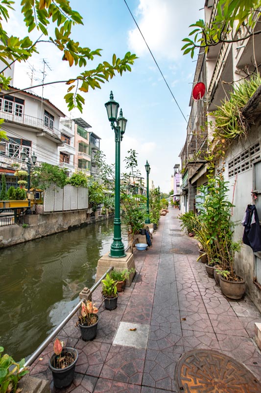 picturesque soi in bangkok with a channel