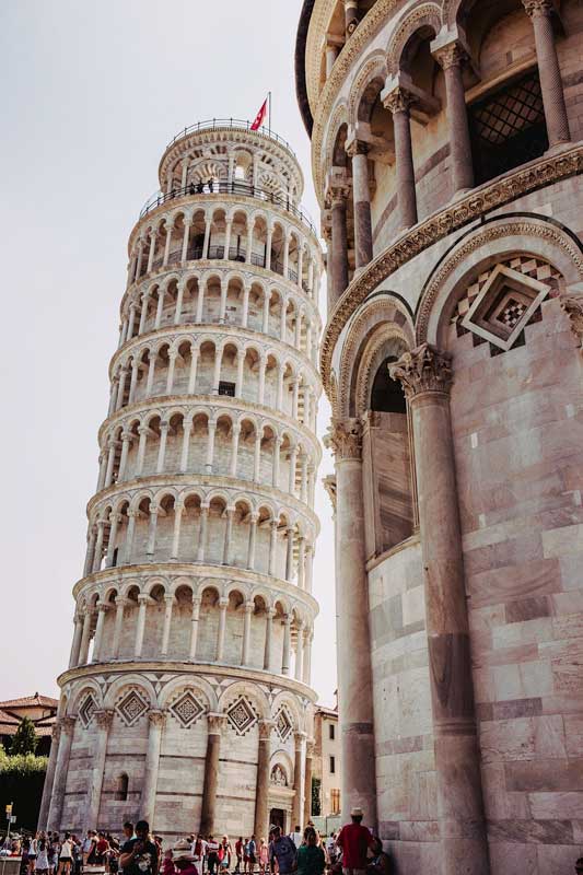 leaning tower of pisa with another building next to it