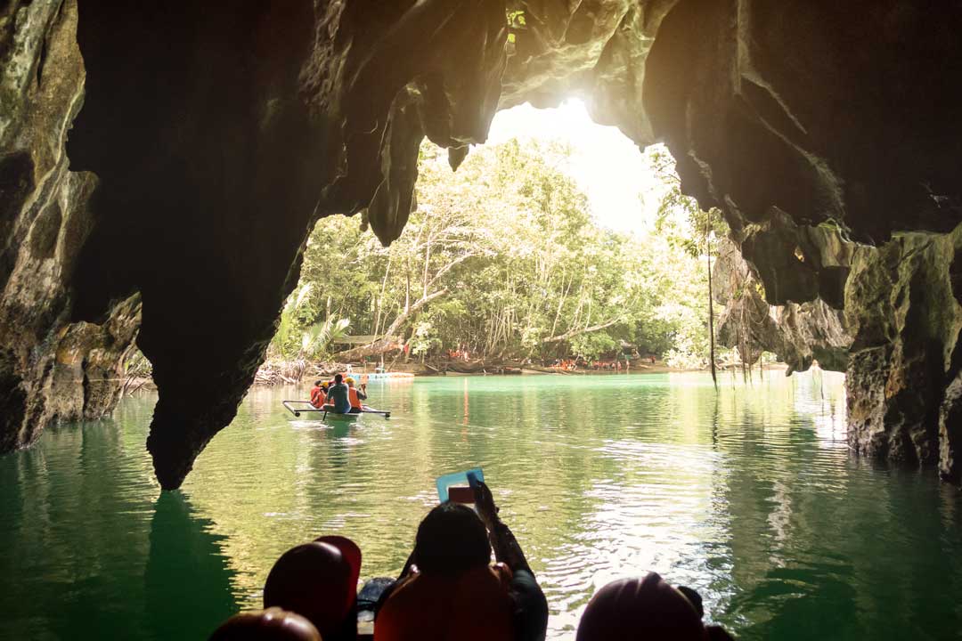 tourists-in-boats-going-out-of-the-underground-river