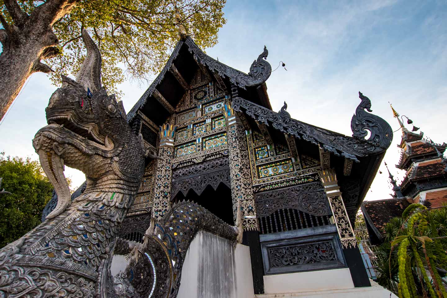ancient Chiang Mai temple with a dragon in front