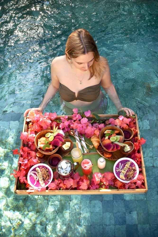 girl-in-a-pool-with-a-floating-breakfast