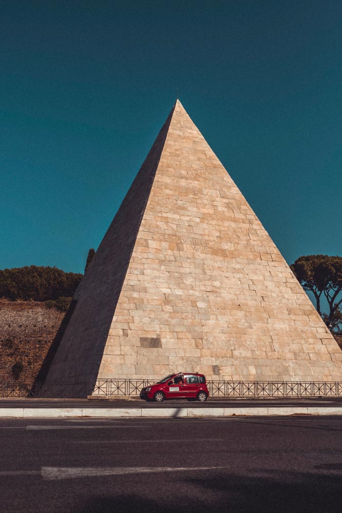 red-car-in-front-of-a-pyramid