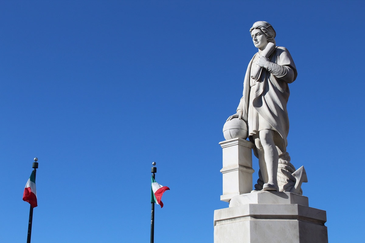 statue-of-columbus-with-two-italian-flags-in-the-background