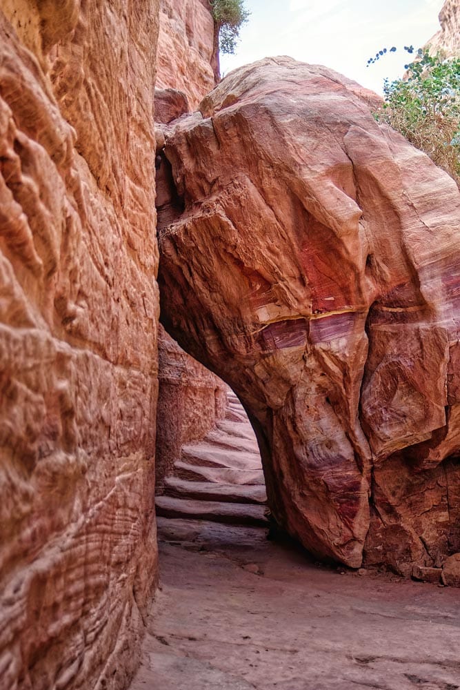 large-rock-almost-blocking-a-mountain-path