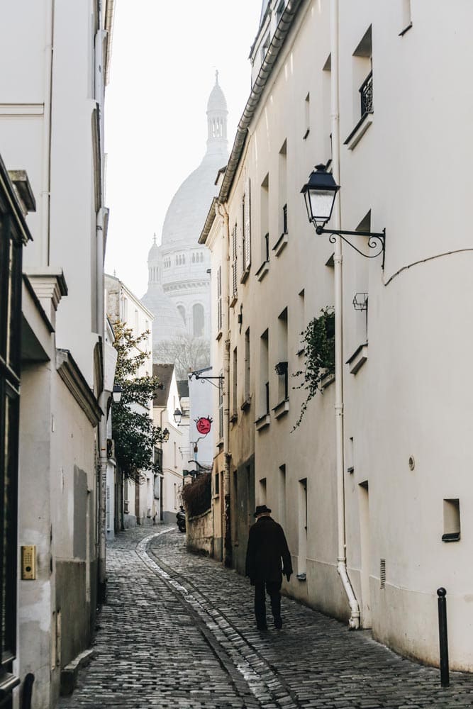 man-walking-in-a-misty-alley-of-montmartre