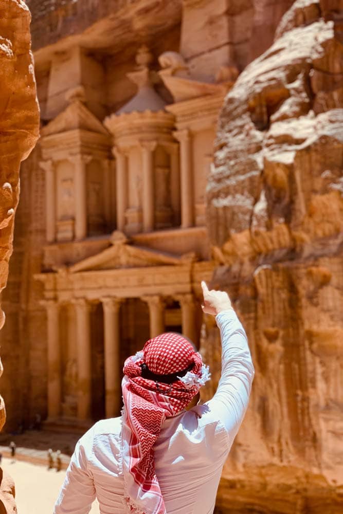 man-with-red-shemag-pointing-at-petra