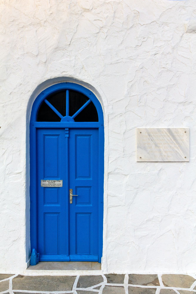 greece-facts-blue-door-on-a-white-facade