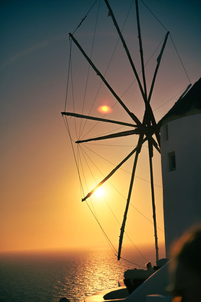 susnset-over-the-ocean-with-a-silhouete-of-a-greek-windmill