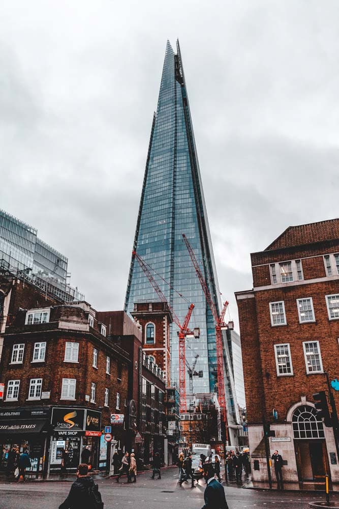 the-shard-standing-tall-in-front-of-vintage-orange-buildings