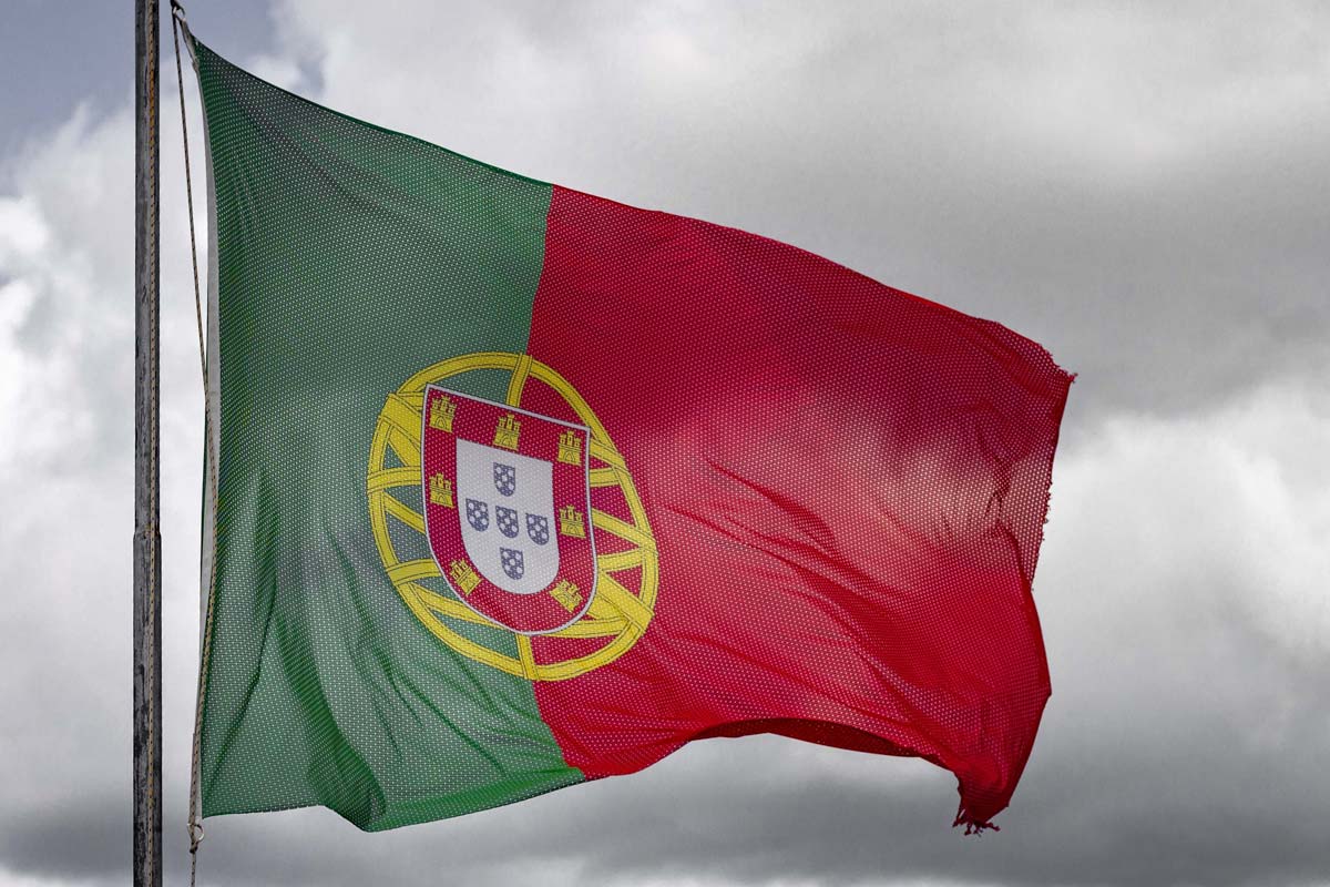 facts-about-portugal-the-flag-with-a-stormy-cloud-background