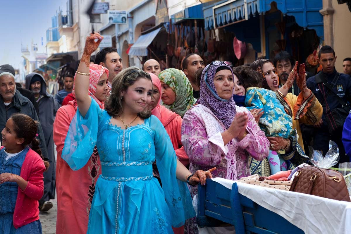 girl-with-a-blue-dress-dancing-on-Moroccan-wedding