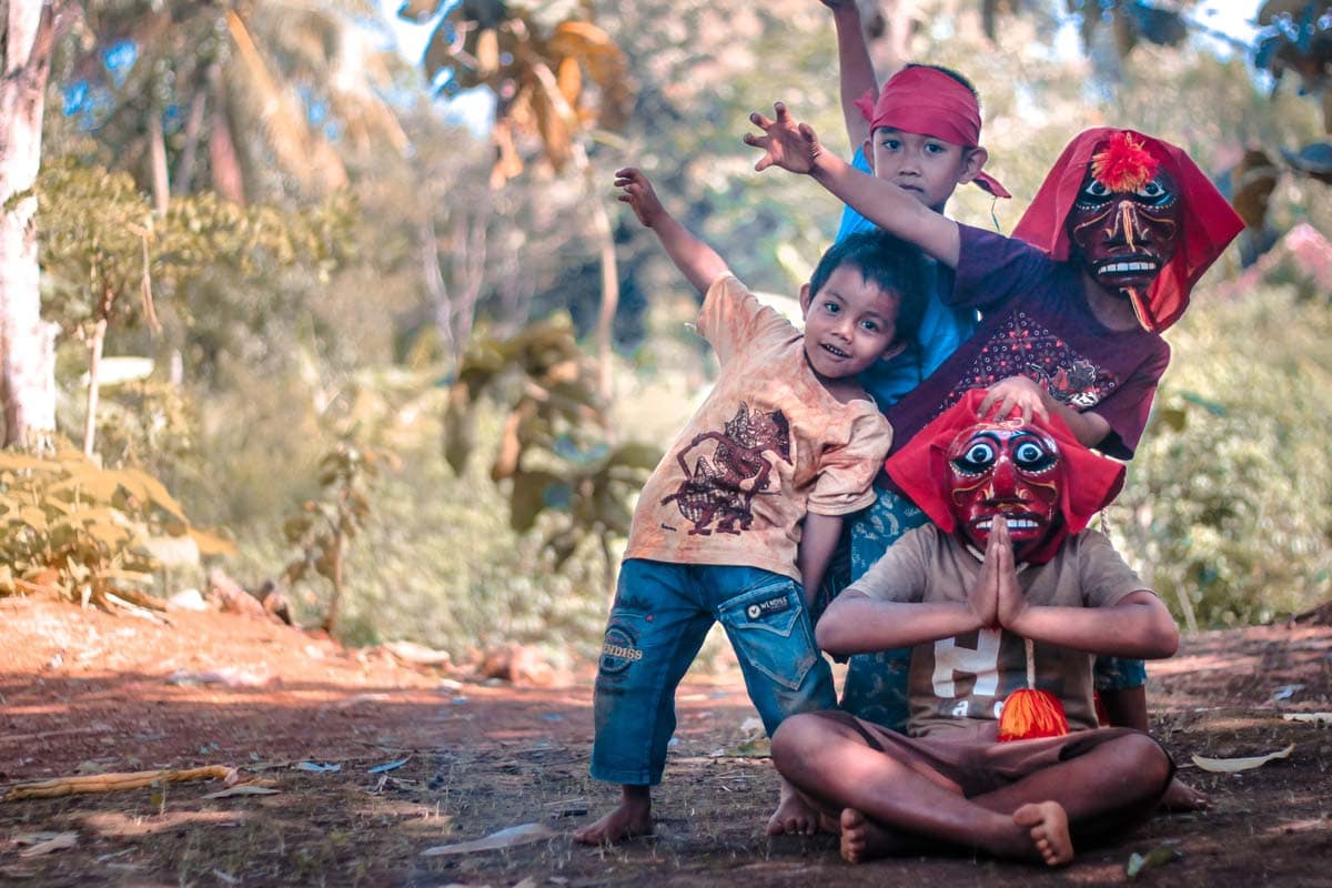 what-is-indonesia-famous-for-children-with-masks-making-signs