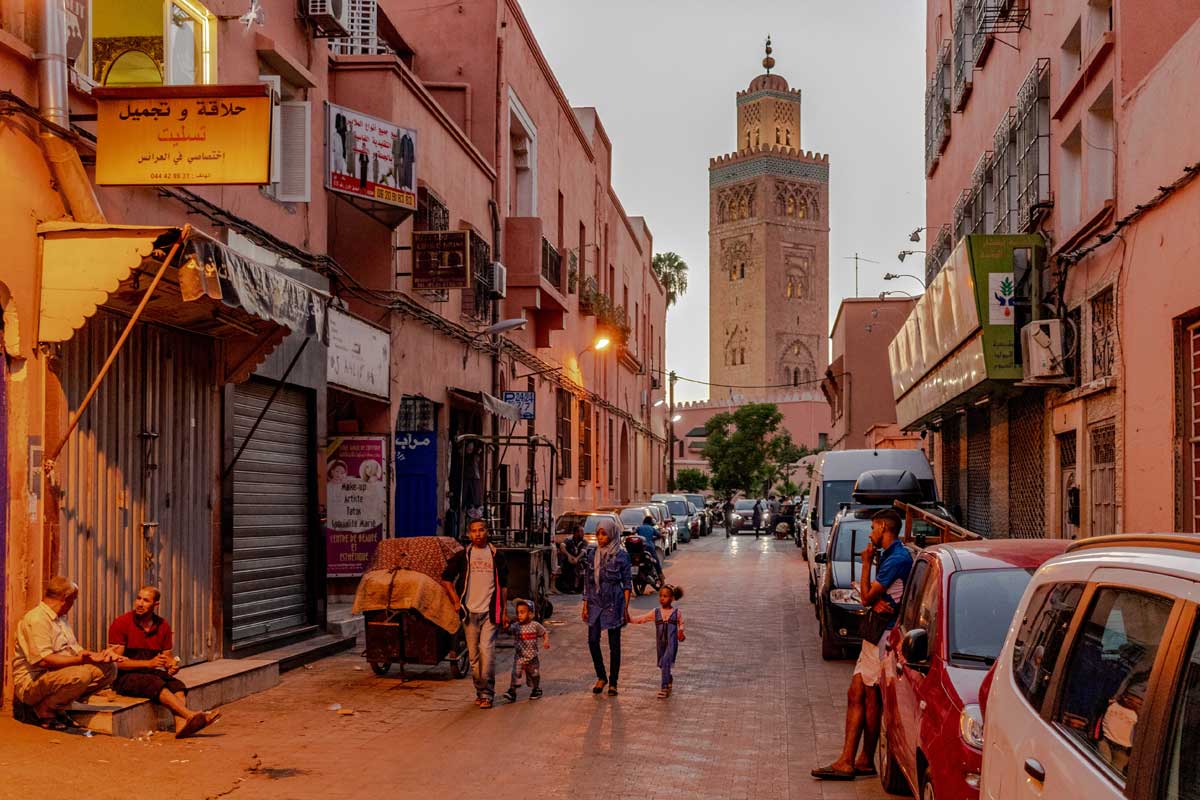 what-is-marrakech-famous-for-an-alley-with-a-tall-minaret-in-the-back