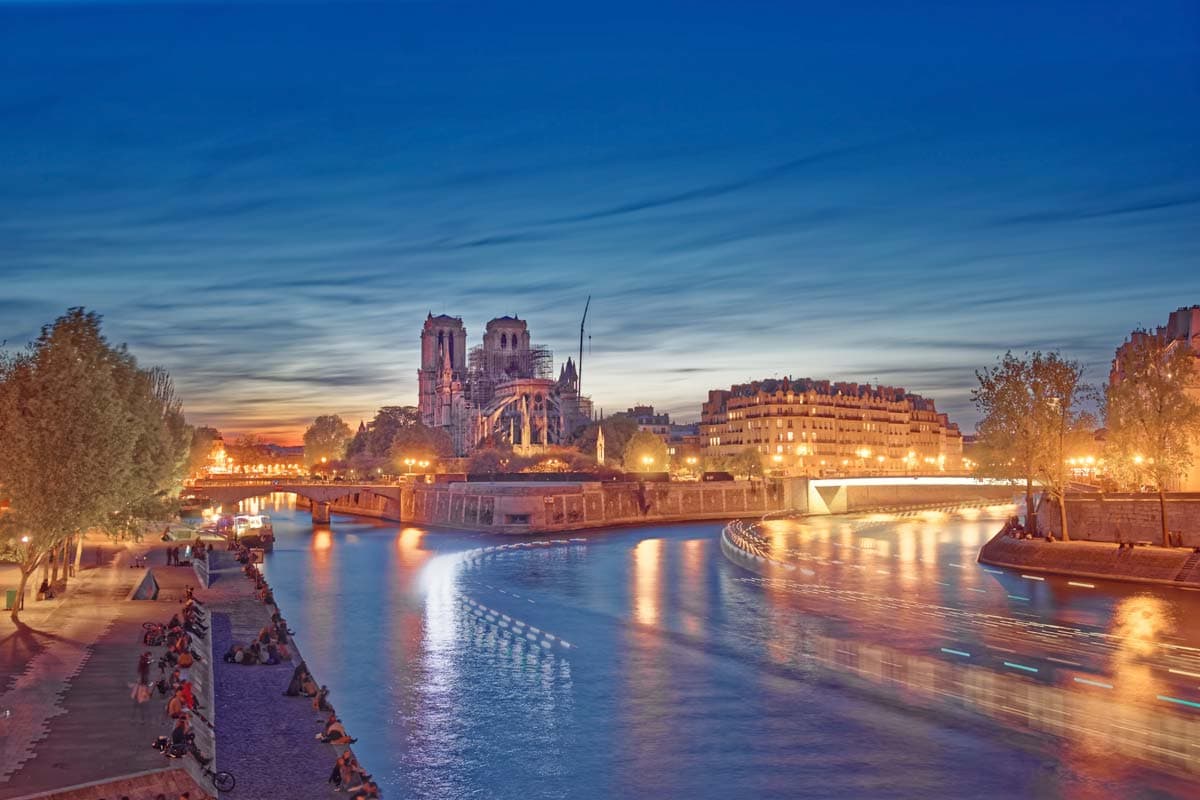 what-is-paris-famous-for-river-seine-at-night-with-many-golden-lights