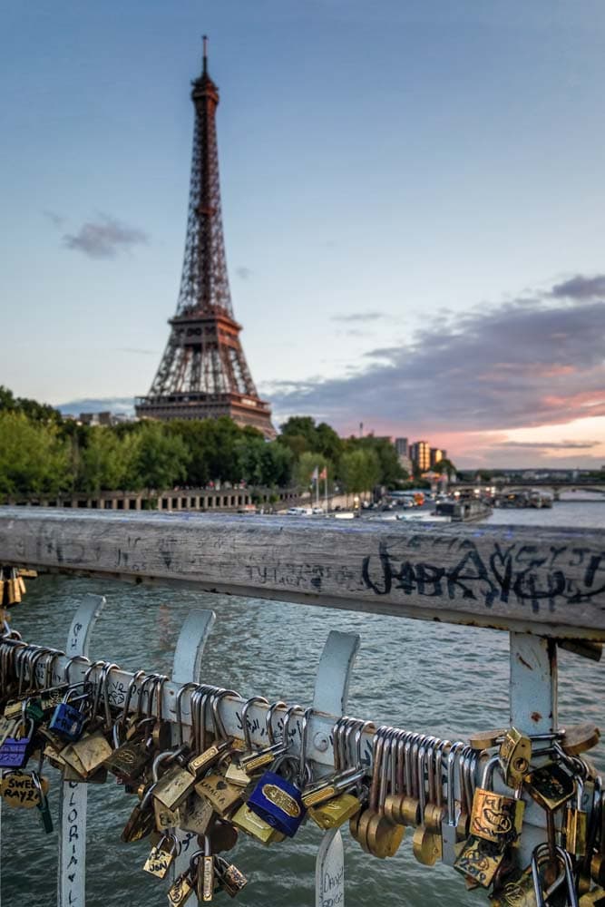 what-is-paris-known-for-love-locks-on-a-bridge-with-the-eiffel-tower-in-the-back