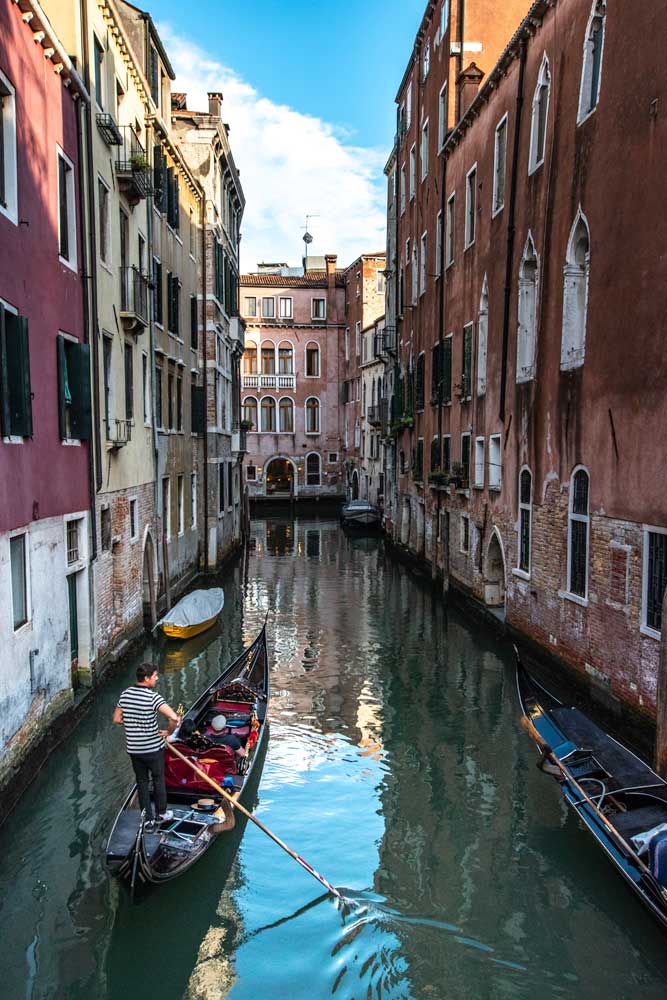 venice-gondola-surrounded-by-colorful-buildings