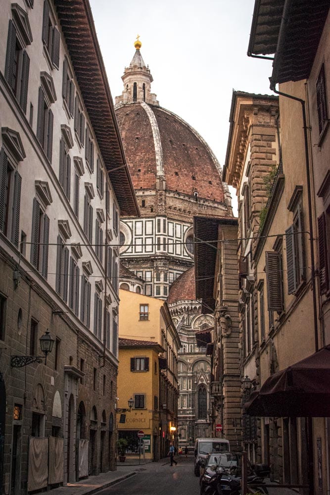 florence alley with the Duomo in the back