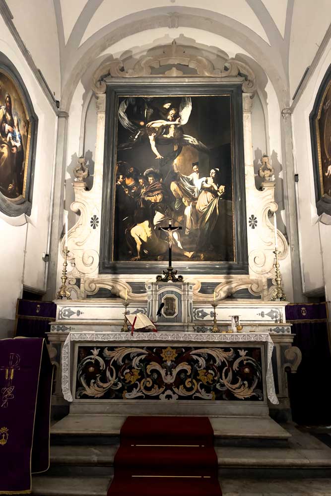 carvagio-painting-inside-a-church