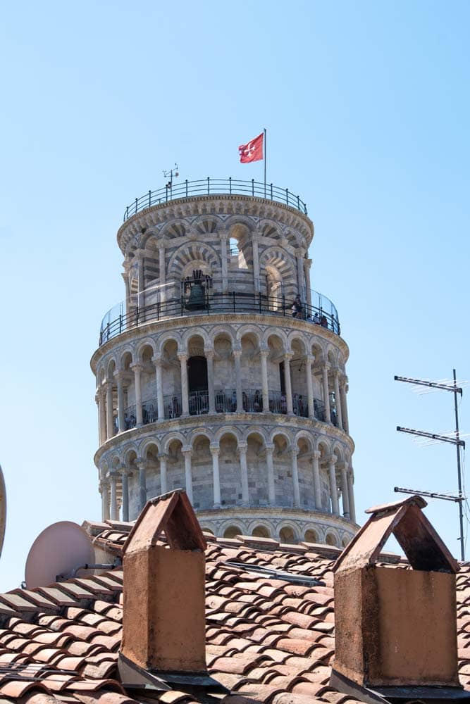 leaning-tower-behind-a-roof
