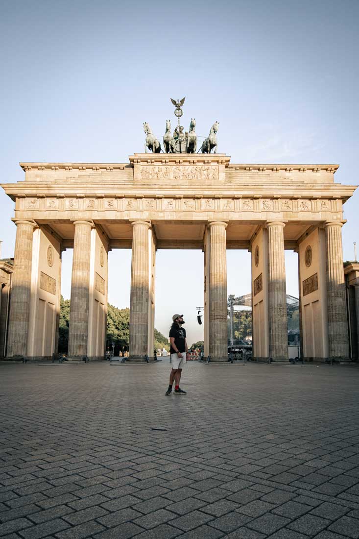 man-walking-in-front-of-brandenburg-gate