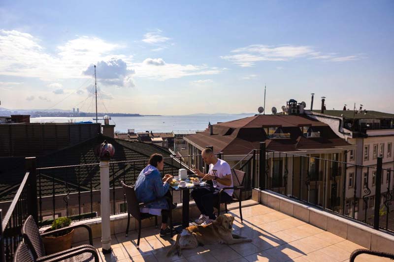 men on a terrace